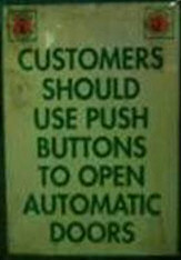 Push button for automatic doors -funny sign